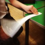 Ruler being slapped on green table